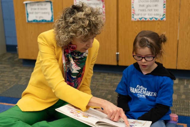 Born Learning volunteer reading to a student