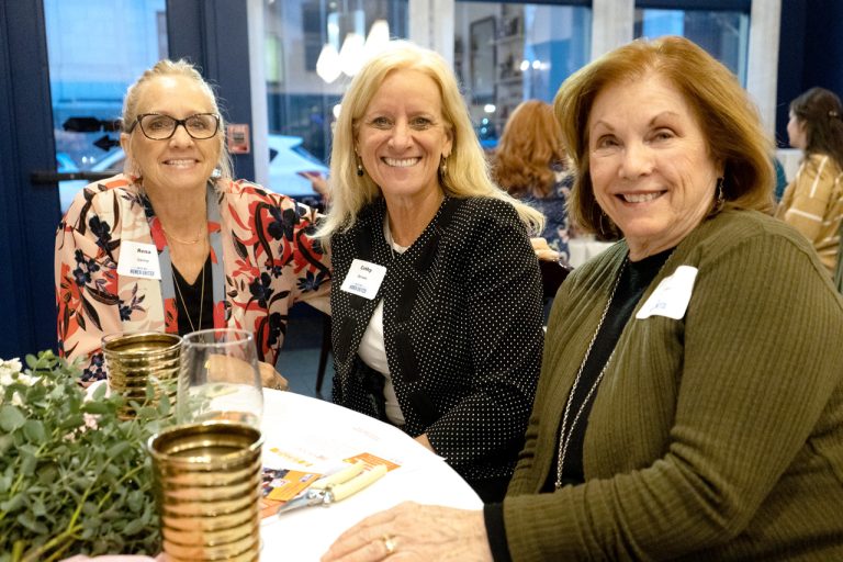 Three-older-women-sitting-around-a-table
