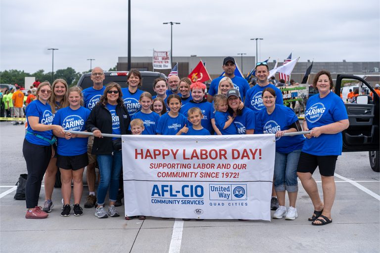 group-of-employees-holding-a-parade-sign