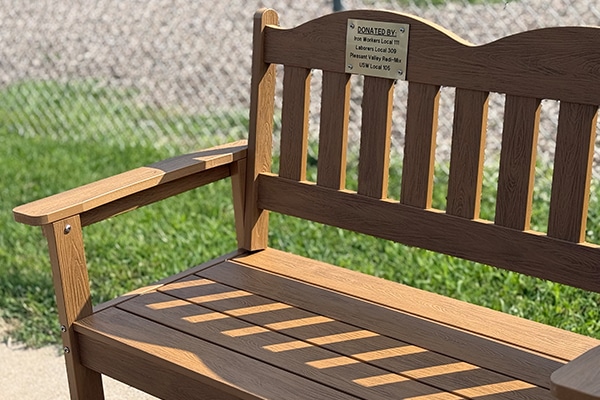 closeup-of-a-wooden-bench-outside
