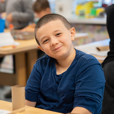 boy-in-a-classroom-smiling