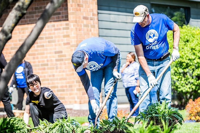 three-volunteers-working-on-landscaping