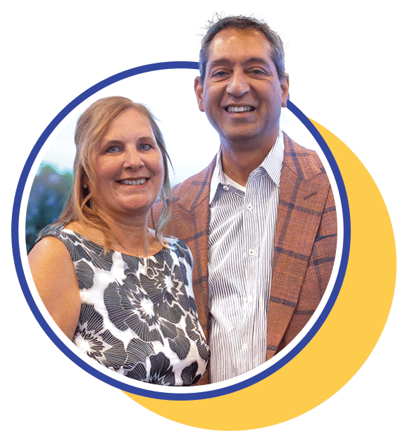 couple dressed nicely standing close together