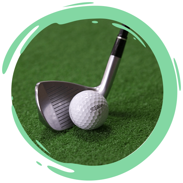 closeup of golf club and ball on the green