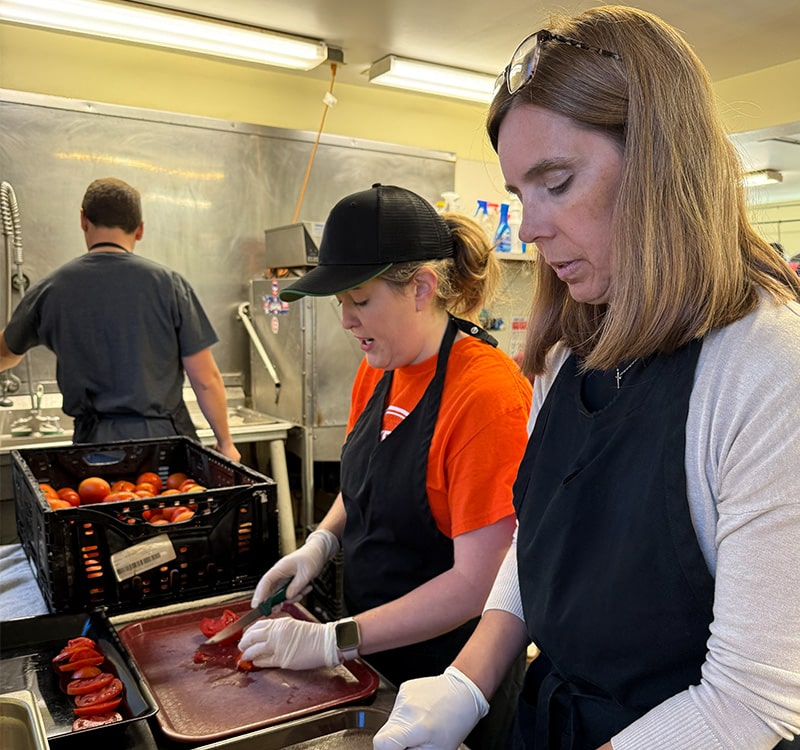 two women working in a kitchen