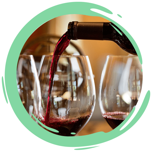 red wine being poured into a glass