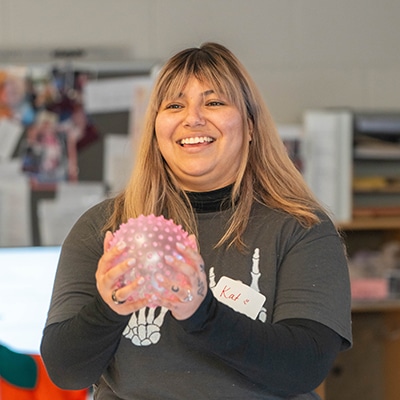 woman-holding-a-ball-smiling