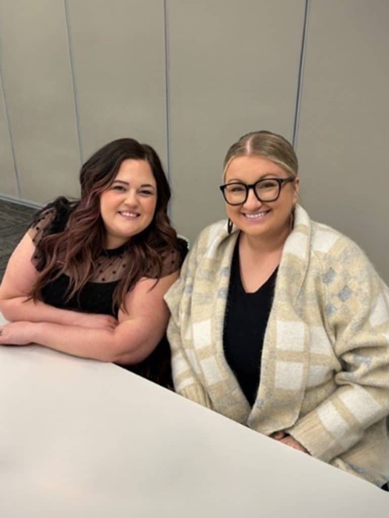 two-women-sitting-at-a-table