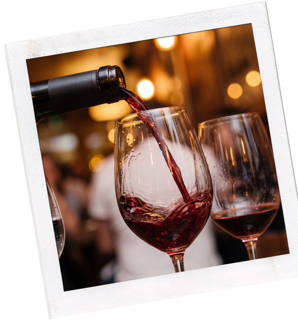 close-up image of wine being poured into a glass