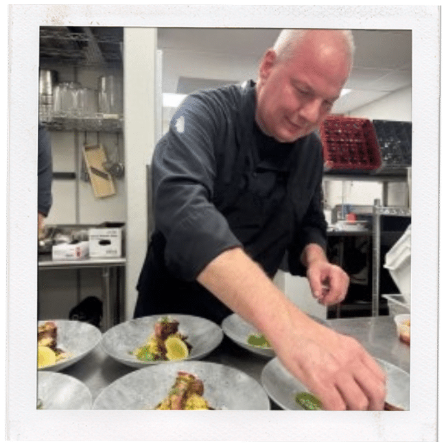 chef preparing food in a kitchen